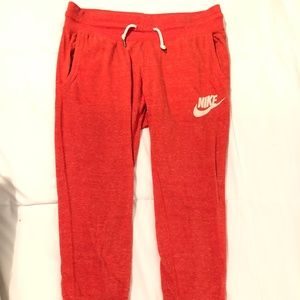 Red Nike joggers